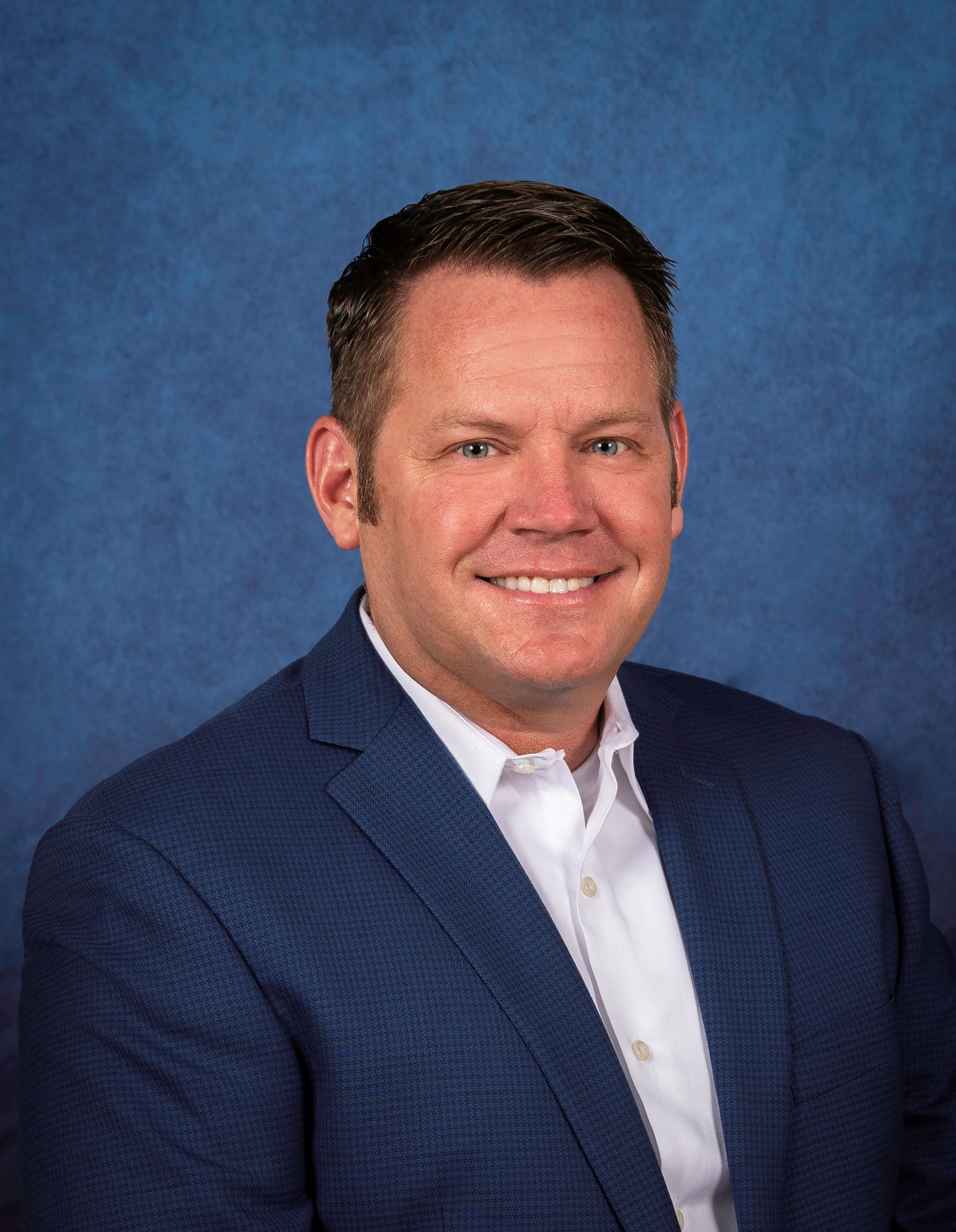 Man in blue suit, blue background