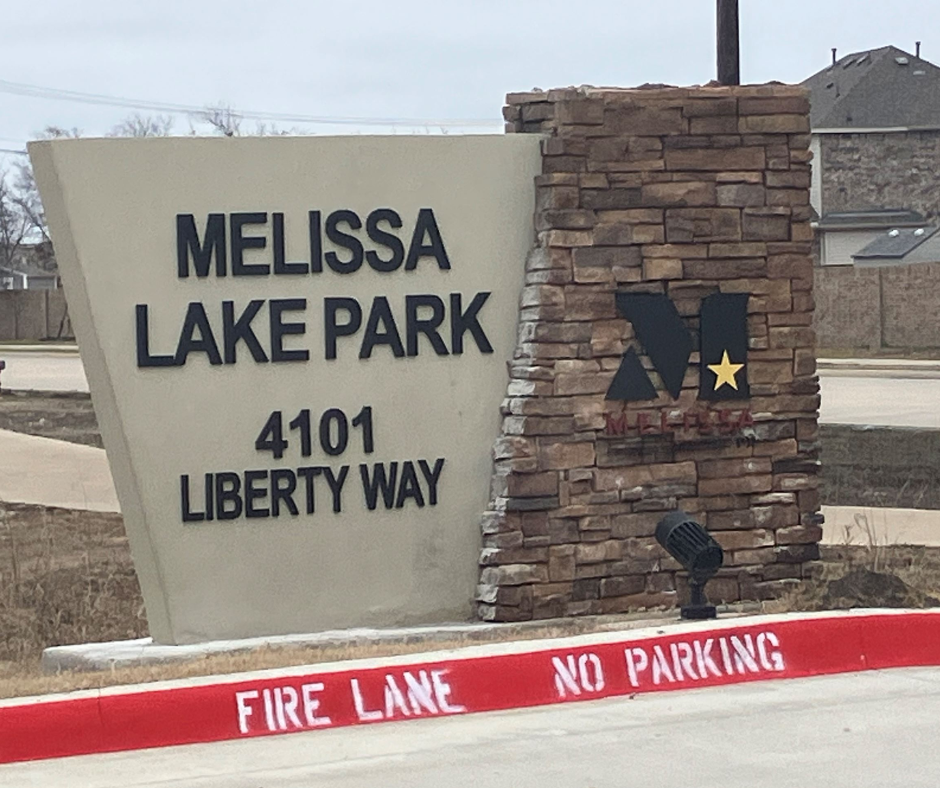 Stone and concrete entrance sign for Melissa Lake Park, located at 4101 Liberty Way. The City of Mel
